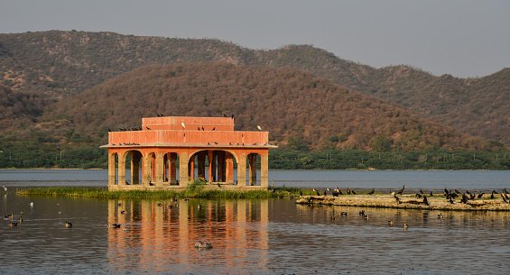 Jal Mahal (meaning Water Palace, built in in the 18th century) in Jaipur, India. The palace, built in red sandstone, is a five storied building.