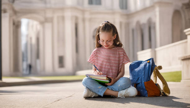 istock Girl with backpack is going to school 1536464888