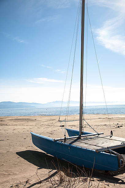 istock Blue Yacht on Beach with Lake 153647327