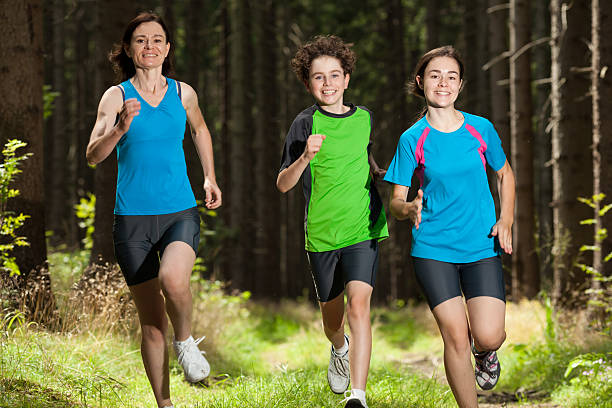 istock Mother and children running outside 153647380