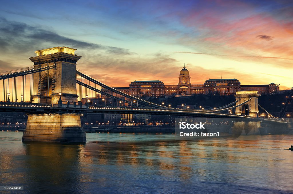 Szechenyi Chain Bridge and Royal Palace Hungarian landmarks, Chain Bridge, Royal Palace and Danube river in Budapest at sunset. Architecture Stock Photo