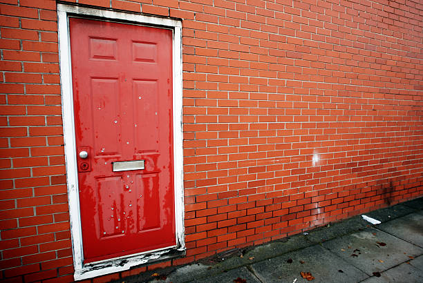 istock Urban red door gunshot with wall copy space 153647862