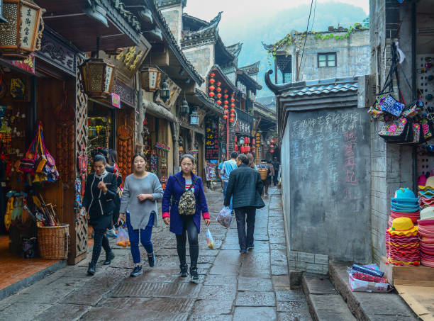 Hunan, China - Nov 5, 2015. People walking on street at Fenghuang Ancient Town in Hunan, China.