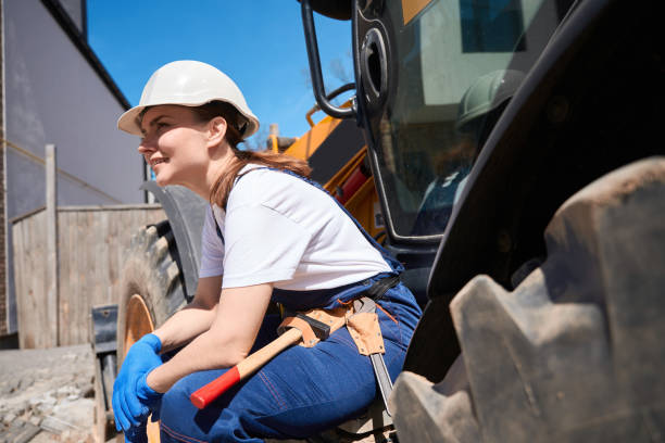 istock Woman building engineer in toolbelt resting after building demolition 1536513740