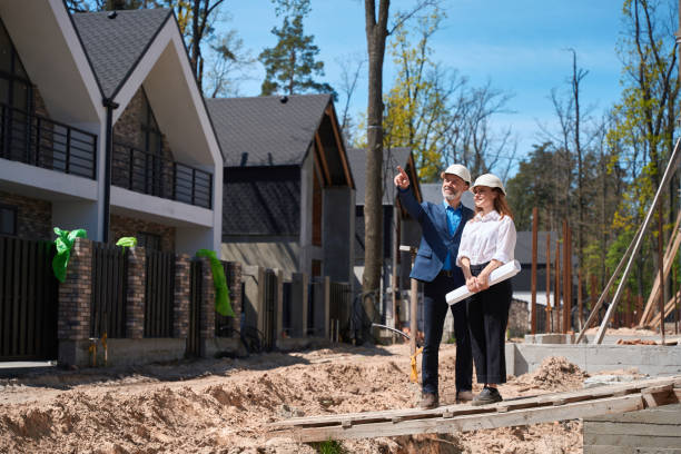 istock Man house developer asking questions to woman head architect about construction 1536513819