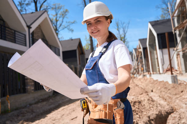 istock Forewoman studying blueprints to beginning paving slab laying 1536514405