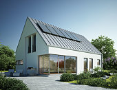 Modern house with metal roof and solar panels
