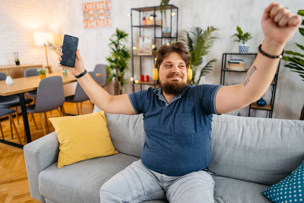 istock Young Man Singing And Dancing At Home 1536522388