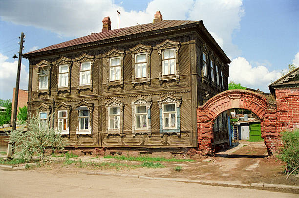 Krasnoyarsk, Russia - August 25, 2022: Restored wooden house on Gorky Street. Kolesnikov estate, 1906 Residential building, estate, gate - classified as monuments of regional significance