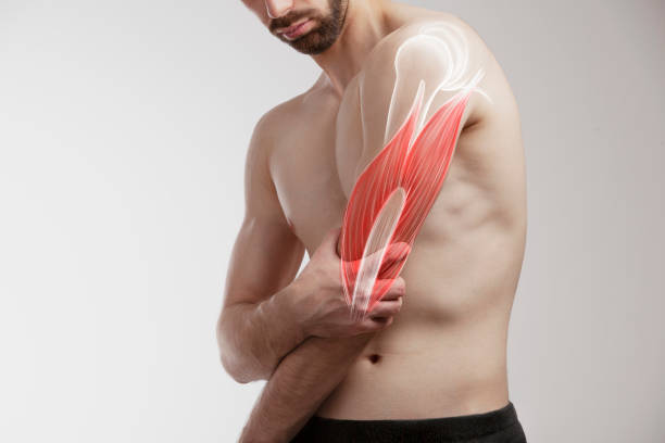 istock Man holding a painfull arm, human arm pain 1536570846