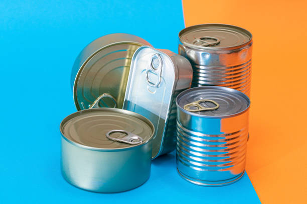 istock A Group of Stacked Tin Cans with Blank Edges on Split Blue and Orange Background 1536576605