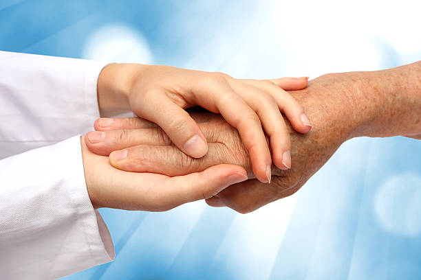 Women hand helping senior stock photo