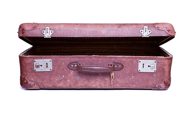 istock Vintage brown suitcase isolated over white background 153658543