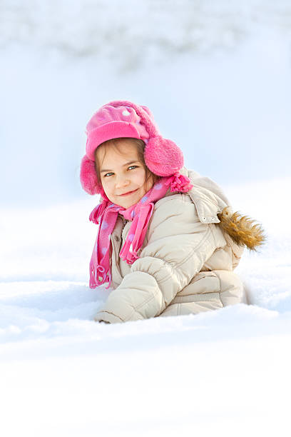 istock Little child playing in snow 153661388