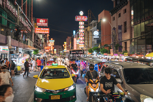 Bangkok, Thailand - June 18 2023: A busy street scene at Chinatown, pedestrians around China town Yaowarat Street in Bangkok Thailand The area originally designated for Chinese settlement it retain significant historical and cultural significance,