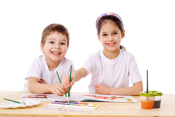 istock Two smiling kids draw with watercolor 153664508