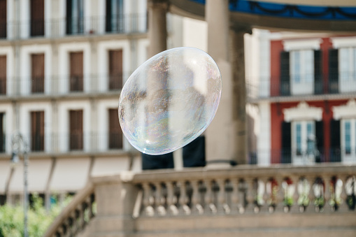 Large soap bubble in a city