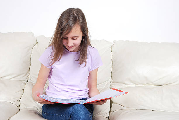 istock Girl student on the couch with a notebook 153667761