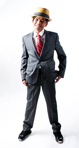 Smiling Thai Boy in Hat and Suit stock photo