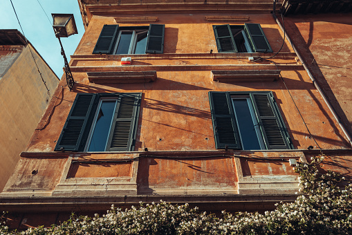 Rome, Italy, June 10, 2023: Life in Trastevere on June 10, 2023 in Roma, Italy. People and tourist walking in Trastevere neighborhood in Rome, during a warm summer sunset