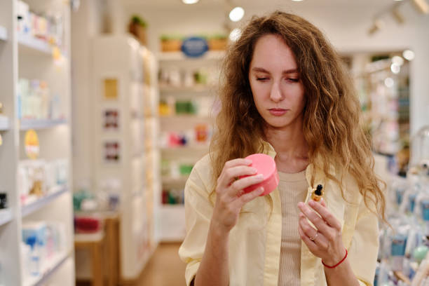 istock Woman choosing cream in the store 1536720692