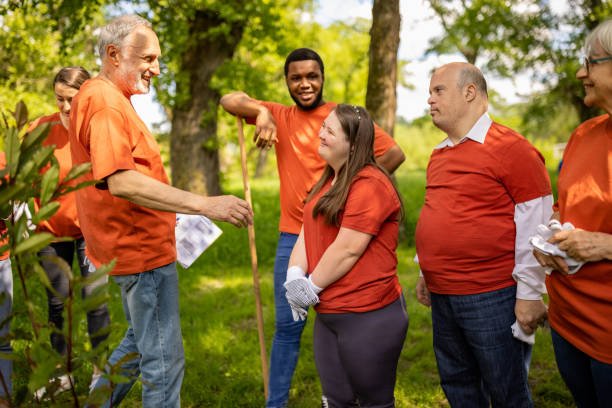 istock Group of volunteers preparing to plant a tree in a forest 1536769037