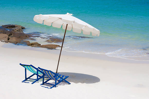 istock Umbrella and the chair 153677221