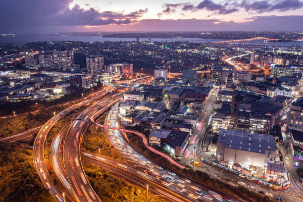Motorway SH1 and SH16 around Auckland CBD leading to and coming from North Shore making congestion in the twilight