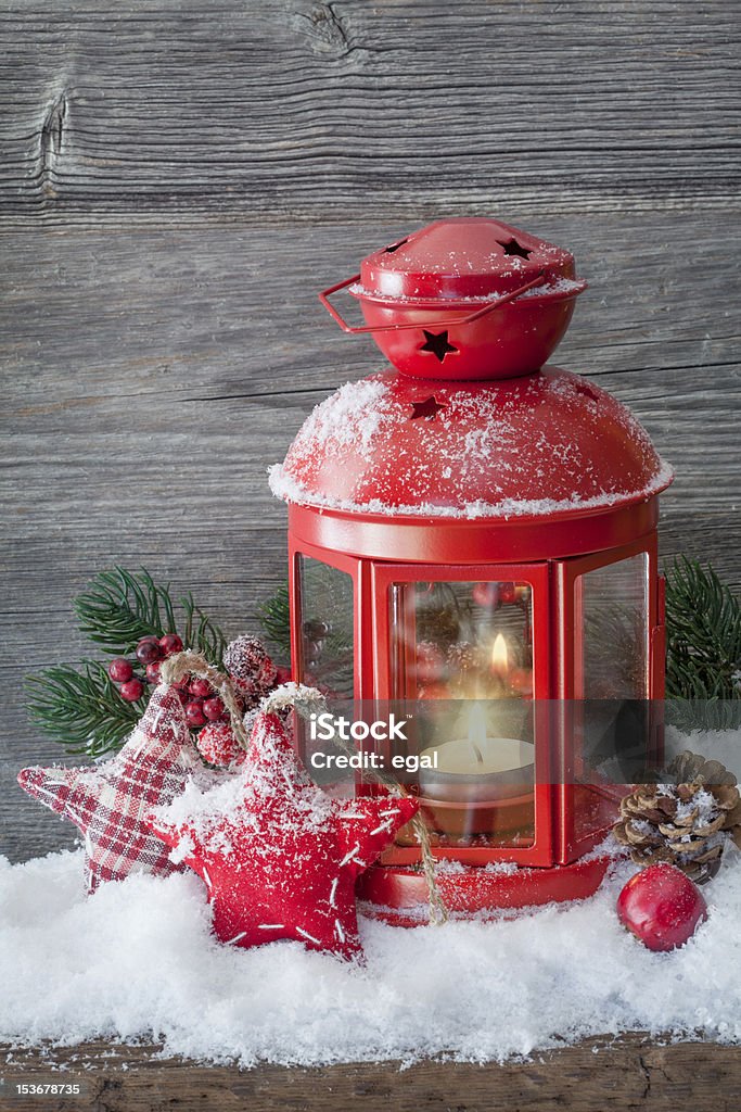 Burning lantern Burning lantern in the snow Advent Stock Photo