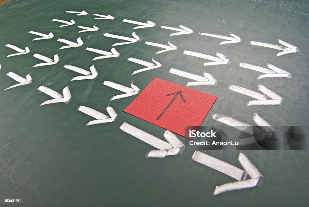 Difference in the group Difference innovation concept. One different direction in the arrow group. Turning Stock Photo