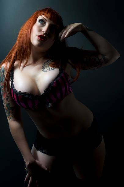 istock Shadowed Female Retro Pinup Model With Tattoos 153681962