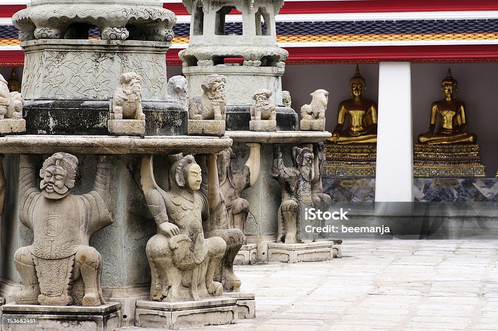 thai ancient building stone statue in wat po,bangkok,thailand Ancient Stock Photo