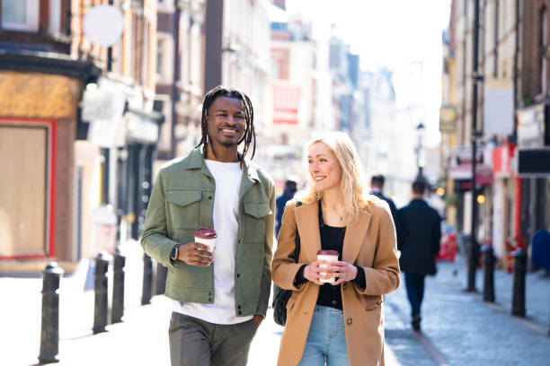istock Relaxed couple walking through London’s Soho district 1536827377