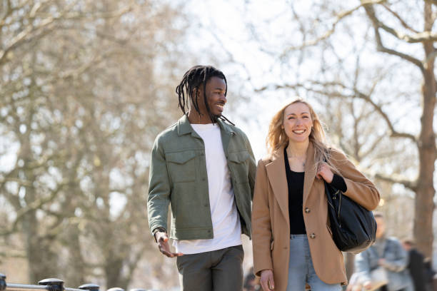 istock Cheerful British couple walking amidst London plane trees 1536827914