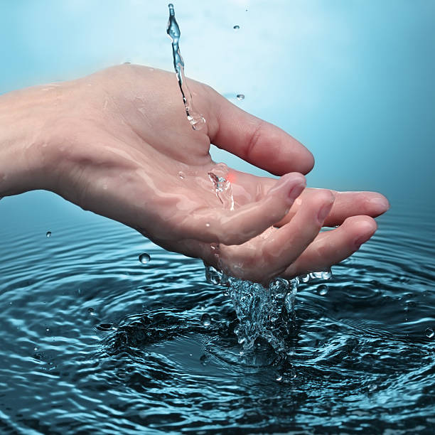 istock woman hand in water 153685028