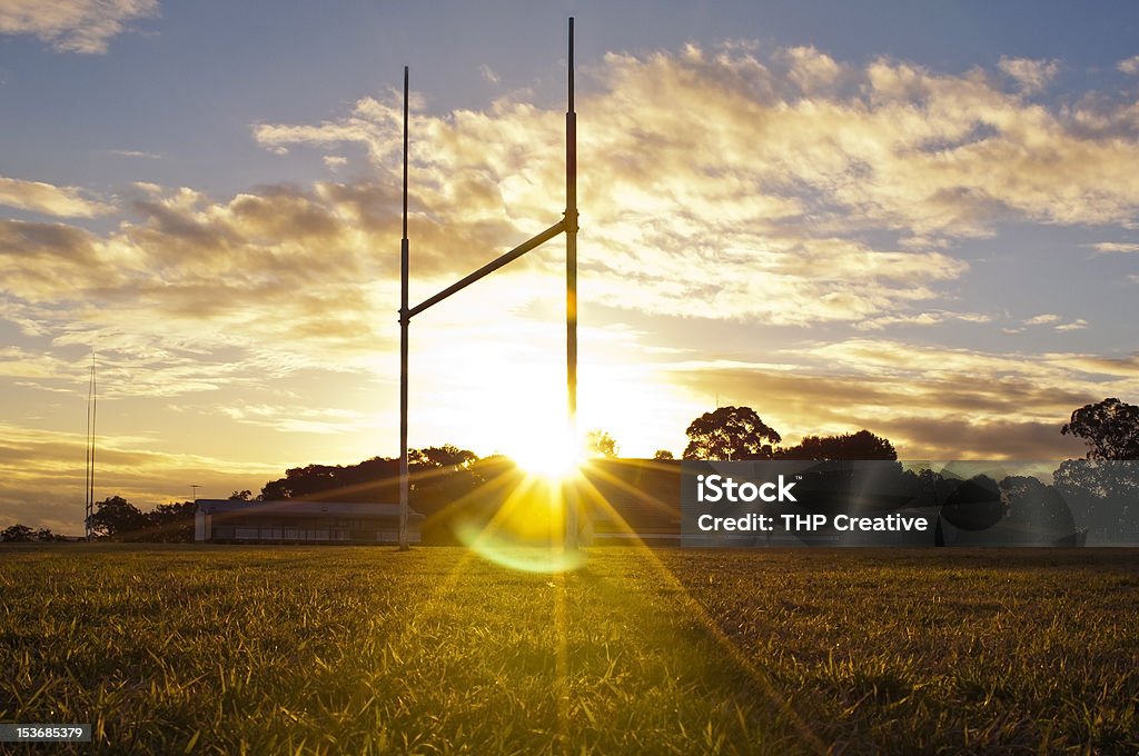 Football Goals Goal posts for football, rugby union or league on field at sunset Rugby - Sport Stock Photo