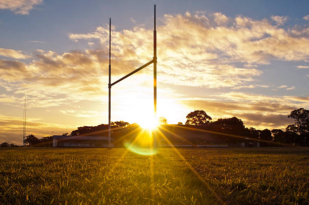 Football Goals Goal posts for football, rugby union or league on field at sunset rugby stock pictures, royalty-free photos & images