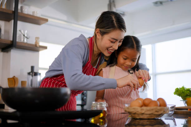 istock Mother and daughter make a meal at kitchen. 1536860975