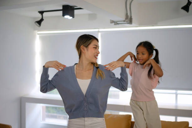 istock Mother and daughter are exercising at home. 1536864452