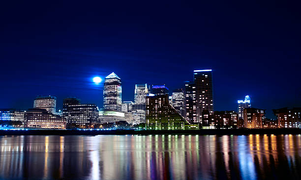istock Canary wharf across the Thames at night 153686997
