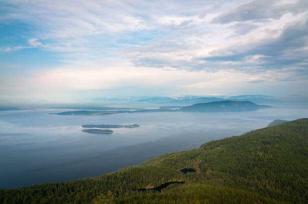 Bird-eye view of San Juan islands in Washington Bird-eye view of San Juan islands in Washington with Mt. Baker on the skyline puget sound aerial stock pictures, royalty-free photos & images