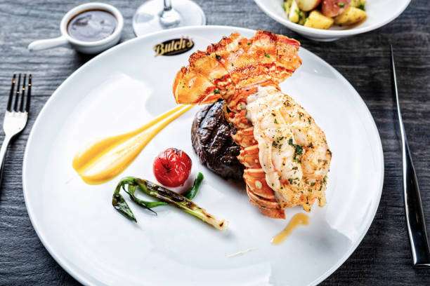 istock Dinner of steak and lobster tail, surf and turf 1536876607