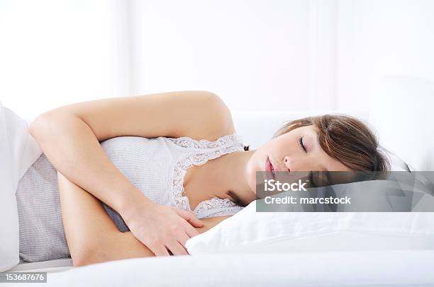 Young Woman Sleeping On The Bed Stock Photo - Download Image Now - Adult, Adults Only, Beautiful People