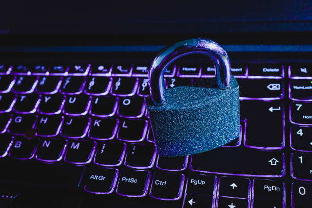 istock Cyber Security Concept.Iron padlock,lock on laptop computer illuminated keyboard.Toned,selective focus,close-up, 1536878325