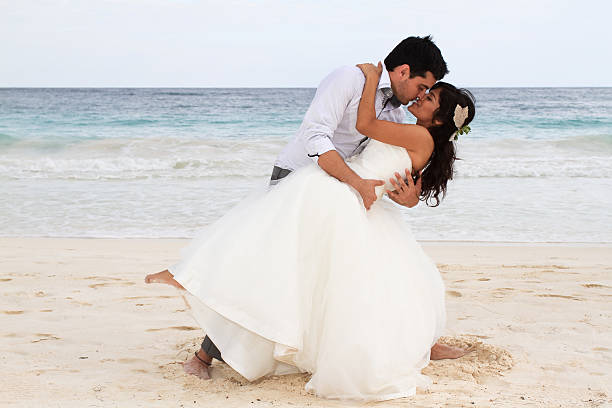 istock Lovely newlyweds on the beach 153688012