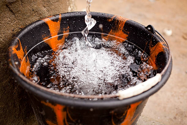 istock clean water from a village pump 153688086
