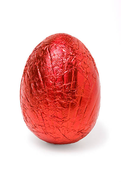 Red color foil covered Easter egg stock photo