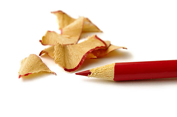 istock Red pencil and wood waste on white background 153688519