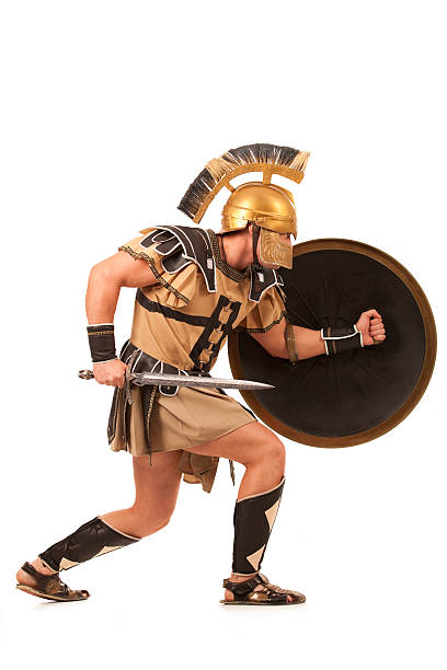 Belligerent  gladiator Warlike gladiator with the golden armor roman army stock pictures, royalty-free photos & images