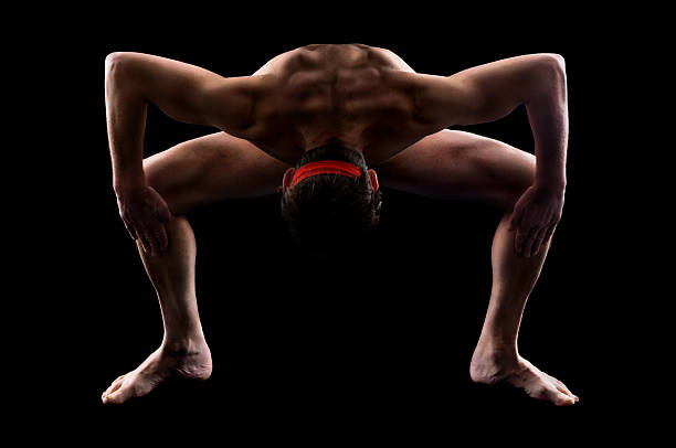 sportler männer und yoga - yoga nudist silhouette naked stock-fotos und bilder